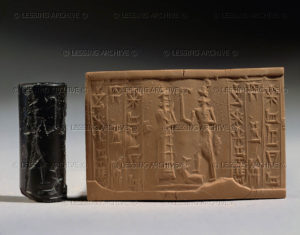 Cylinder seal and imprint, Paleo-Babylonian, from Tello Offering scene before a god brandishing a curved stick. Haematite, H: 2,8 cm MNB 1471