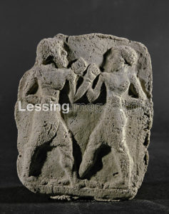 Two wrestlers or boxers. Terracotta relief from Eshnunna,late 3rd mill.BCE. 10 x 8 cm AO