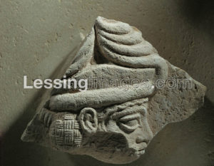 Fragment of a stele showing a god with a crown of horns Period of king Gudea,around 2100 BCE. From Tello. Limestone, H: 13 cm AO 4571