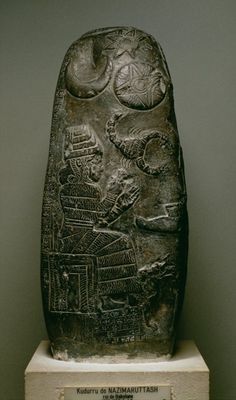 32 - Nannar's Moon Crescent, twins Utu-Inanna's Sun Disc & 8-Pointed Star, Ishara's Scorpion, & Nuska's Oil Lamp symbols; Bau & her dog on kudurru stone