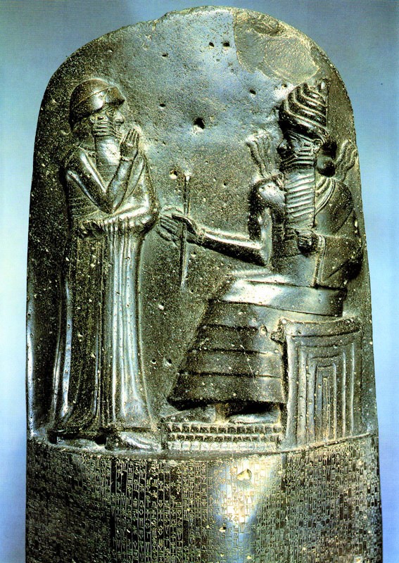 1ba - Babylonian semi-divine giant King Hammurabi stands ready for instructions from alien & bigger giant god Utu; ancient scene in history so important that it had to be recorded for all time in stone