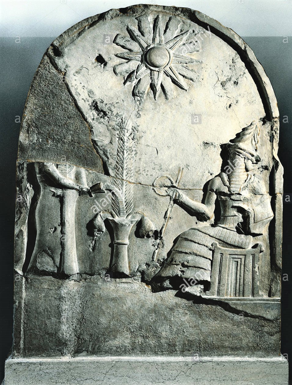 1f - damaged semi-divine king receives his instructions from Utu the Sun god seated in front of him; a time long forgotten when the gods walked & talked with the semi-divines; ancient artifact in the Louvre museum, Paris