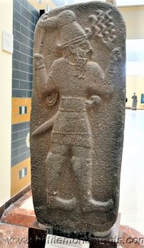 11 - Adad stele in museum; he is depicted with alien weapons that earthlings could not understand for they sounded like thunder & struck like lightning leaving a vast wasteland
