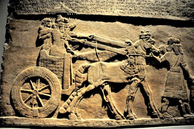 18i - Tiglath-Pileser III & spouse in his royal chariot, ancient reliefs cut into rock to assure they last for all time, our forgotten ancient history