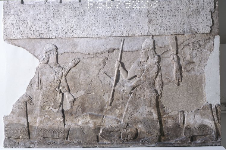 18k - official & Tiglath-Pilser III with his foot upon a prisoner, artifact cut into rock so as to last for all time, adding to our forgotten, untaught history