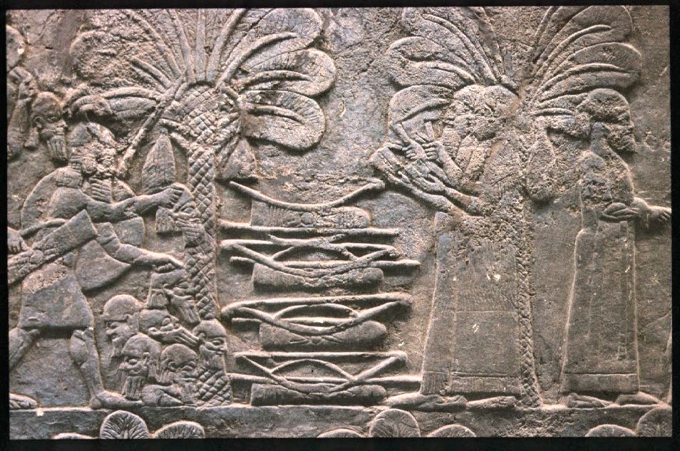 20n - Assyrian scribes count Hebrew heads being stacked in a pile