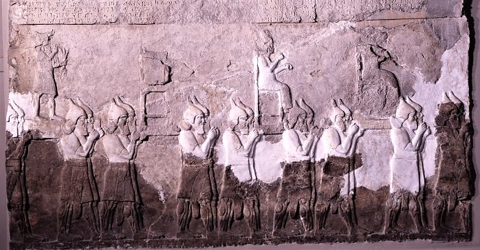31 - Adad, Bau, & Inanna in procession; rock relief of a historic scene of the gods from ancient Mesopotamia