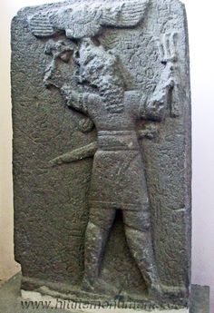 32 - ancient Adad stele with alien weaponry & alien winged sky-disc / flying saucer above, Adad depicted with alien weaponry misunderstood by early man, but the sight & sound of alien weaponry they witnessed