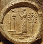 2i - Nabu's double stylus, Marduk's rocket, & Nannar's Moon crescent symbols; Nannar in temple on a seal