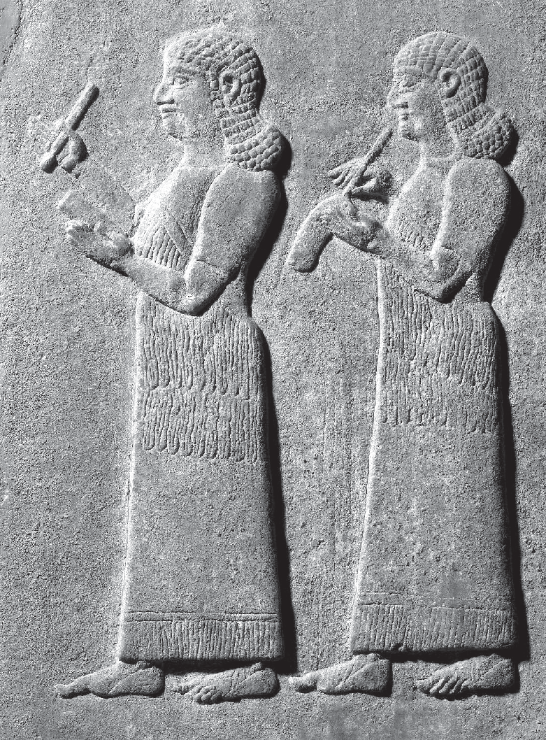 58 - Relief carving from the central palace at Nimrud showing two Assyrian scribes ca-728