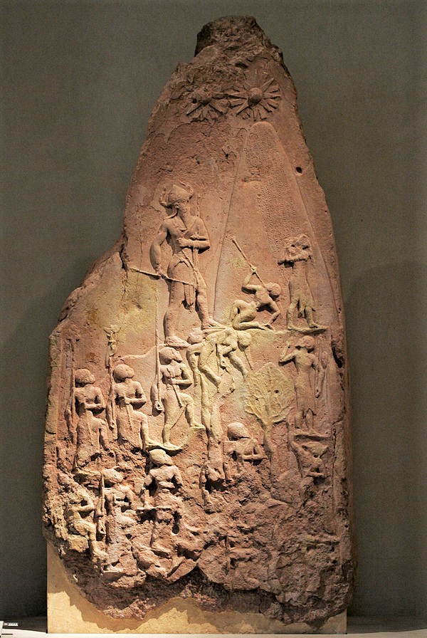 6d - Victory stele of giant semi-divine King Naram-Sin standing by alien shem, scene implies alien intervention into the battle granting his assured victory