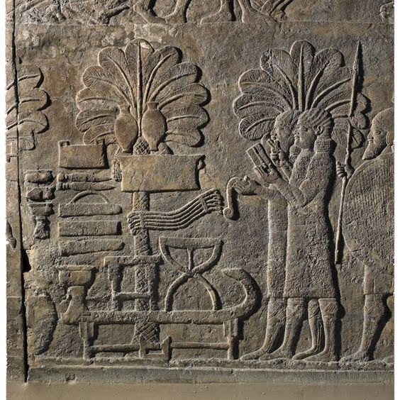 Assyrian artifact of scribes counting heads