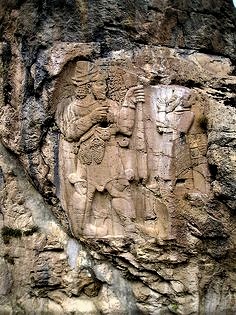 5c - rock carving of giant god Adad & his smaller king