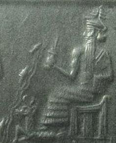 1j - Enki, God of Waters, seated upon his throne in Eridu, his Goat-Fish symbol at his feet