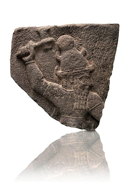 65 - Mesopotamian fragment of Adad stele holding Viking god Thor's hammer, or a thunderous weapon of the gods