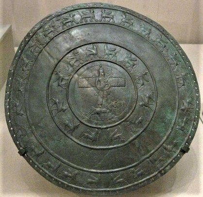 69 - 629-615 B.C. sheild of King Uratu Rusa III with winged sky-disc flying saucer, & giant god Adad inside