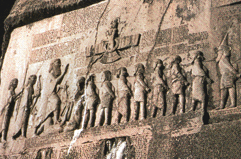 52 - giant King Darius  with captives, & Ashur above giving protection